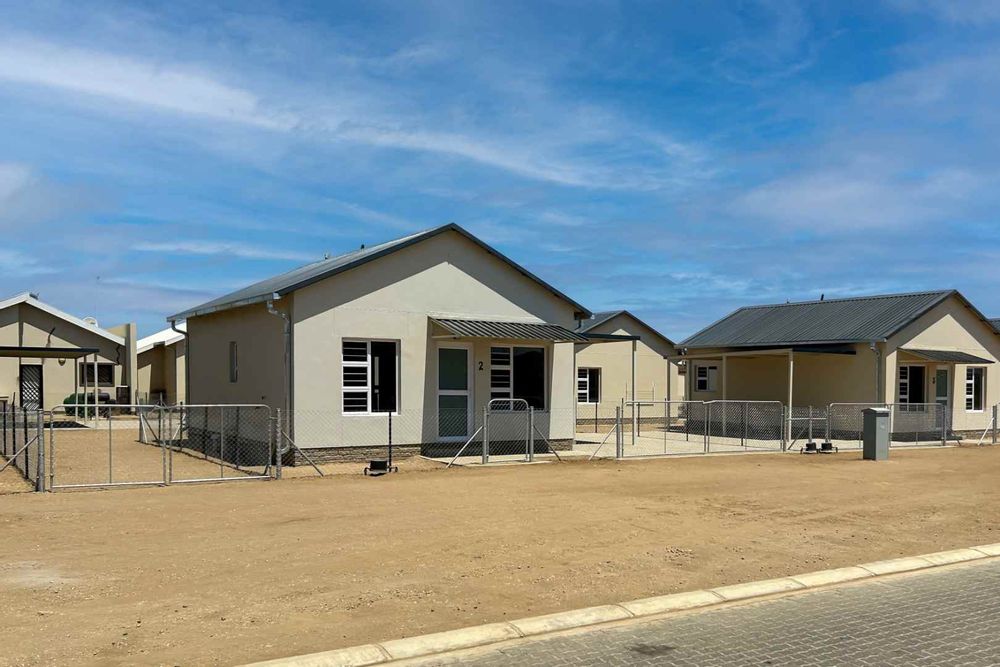 Freestanding townhouse with provision for future expansion and carport.