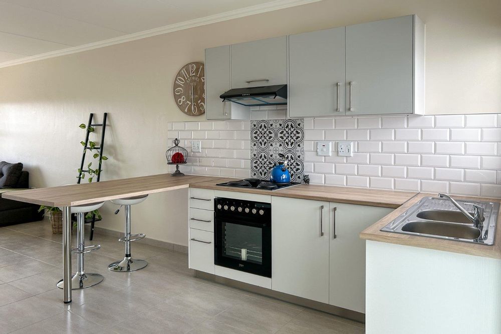 Kitchen with plenty of built-in cupboards and a built-in oven.