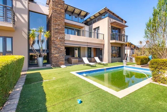 For Sale: House in Copperleaf Golf & Country Estate with pool, golf views, and amenities.