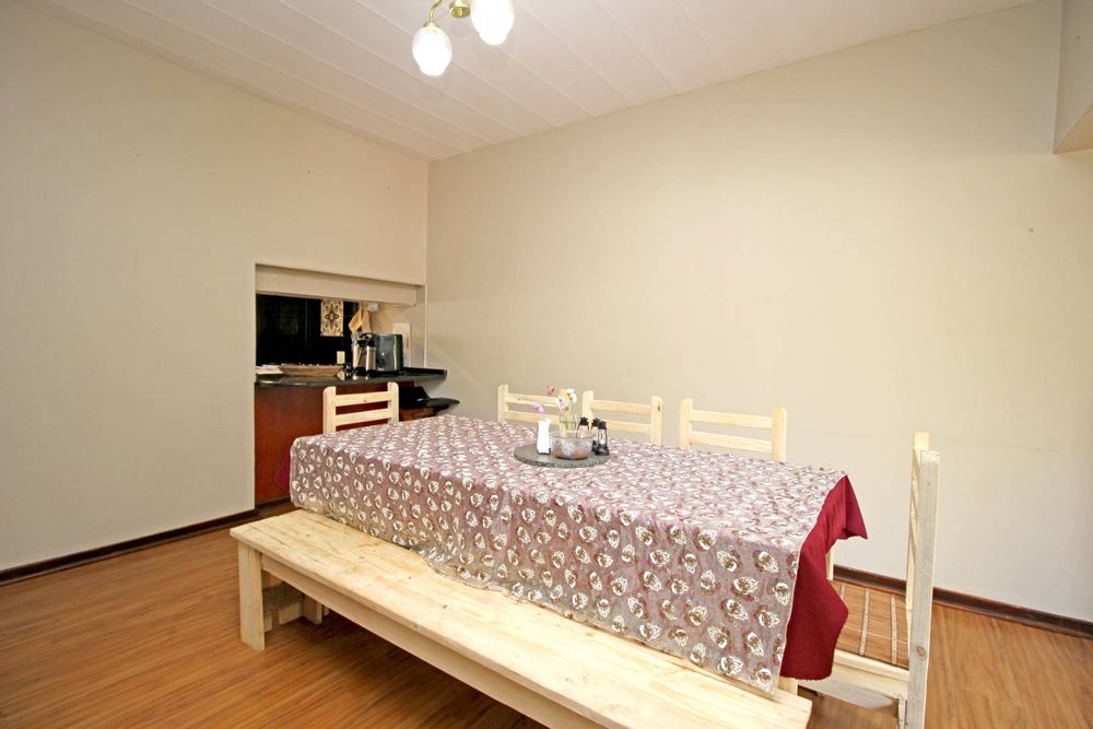 DINING ROOM OFFERS ACCESS TO THE KITCHEN THROUH THE KITCHEN HATCH AND THE BREAKFAST NOOK AREA