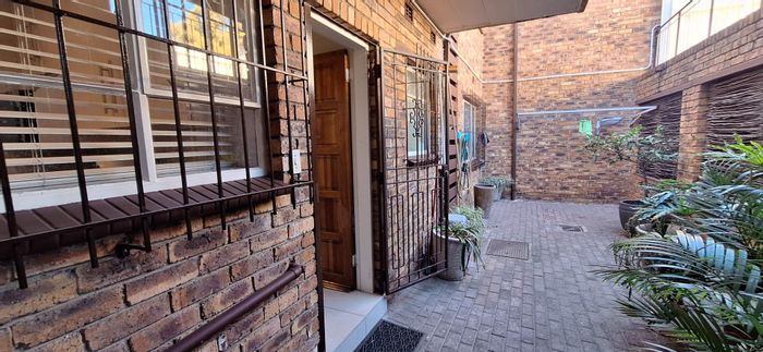 South Crest Townhouse For Sale: 2 beds, garage, balcony, low-maintenance living.