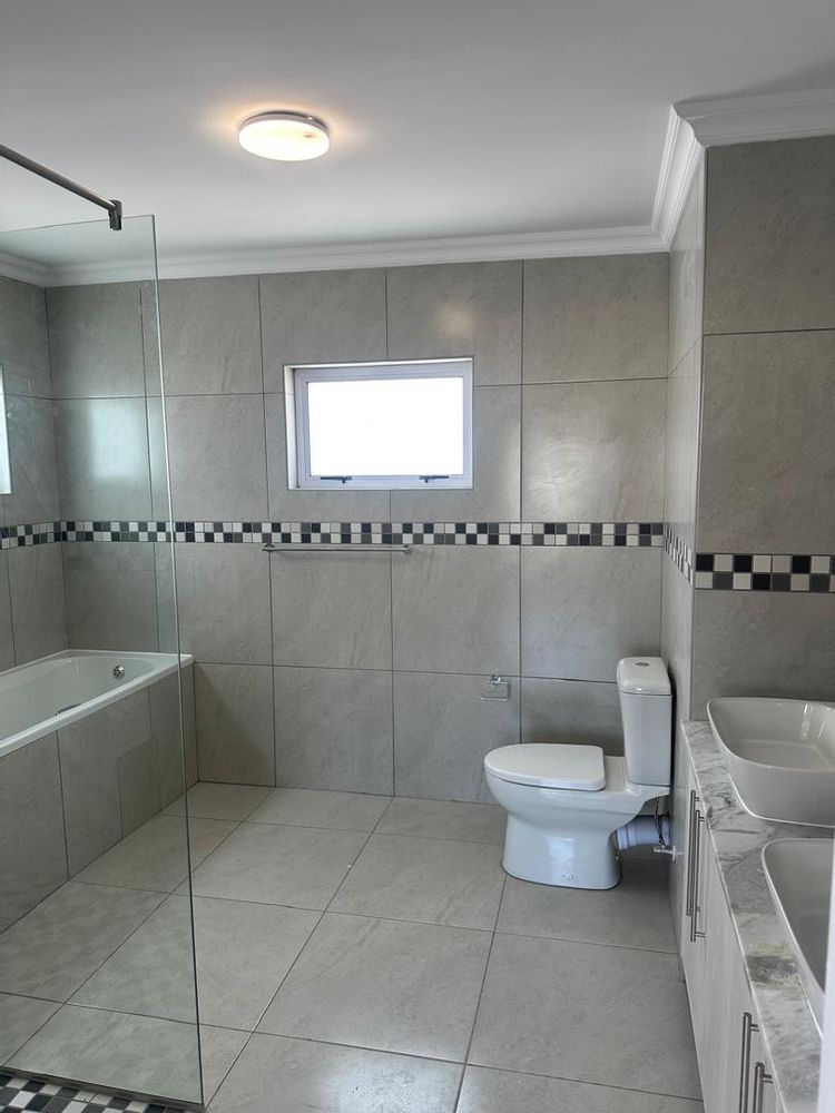 Onsuite bathroom with bath and shower