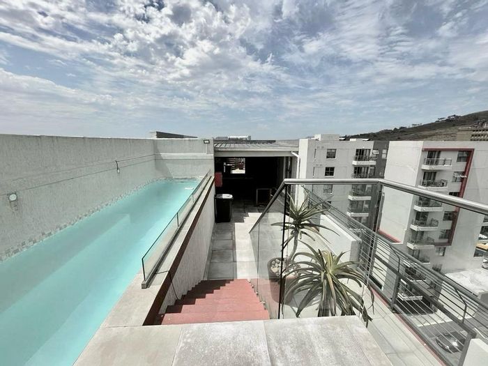 Two-bedroom apartment in Observatory with balcony, parking, and rooftop amenities. To Rent.