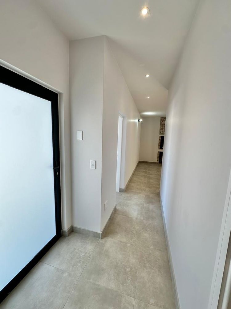 Hallway with garage to the left