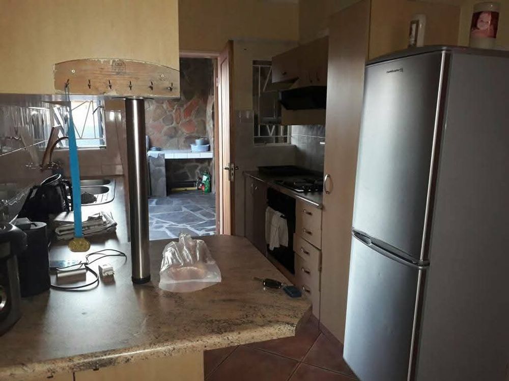 VIEW FROM KITCHEN TO BRAAI AREA