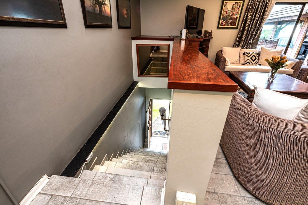 One flight of steps leads up to a stepless townhouse