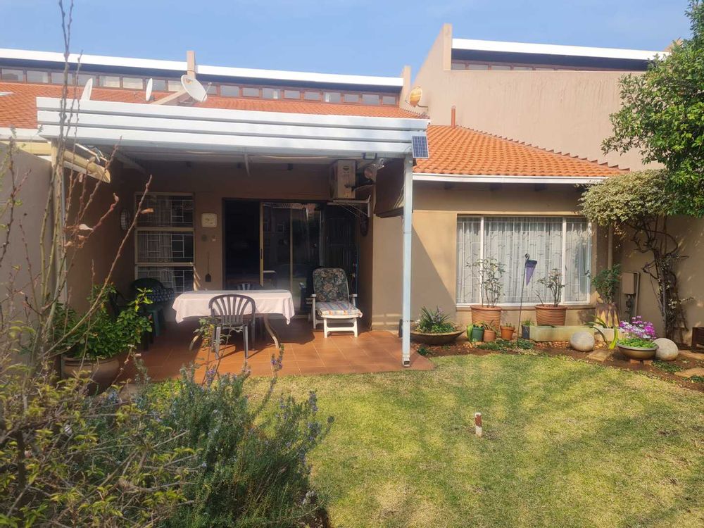 Front patio with louvre roof and garden