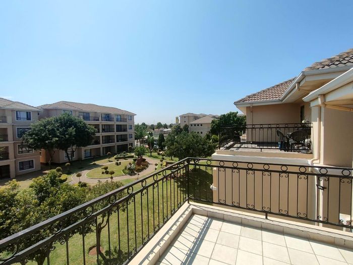 For Sale: Apartment in Carlswald North with balcony, security, pool, and tennis courts.