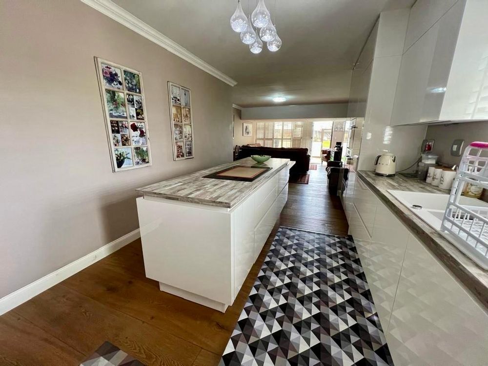 Kitchen with built-in cupboards and stove