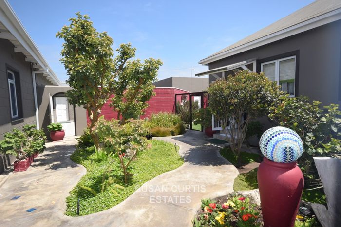 House for Sale in Swakopmund Central: 3 Bedrooms, 3 Flats, BBQ Room, 5 Garages.