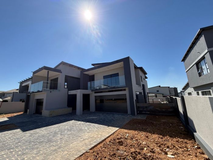 For Sale: House in Six Fountains Estate with pool, guest suite, and triple garages.