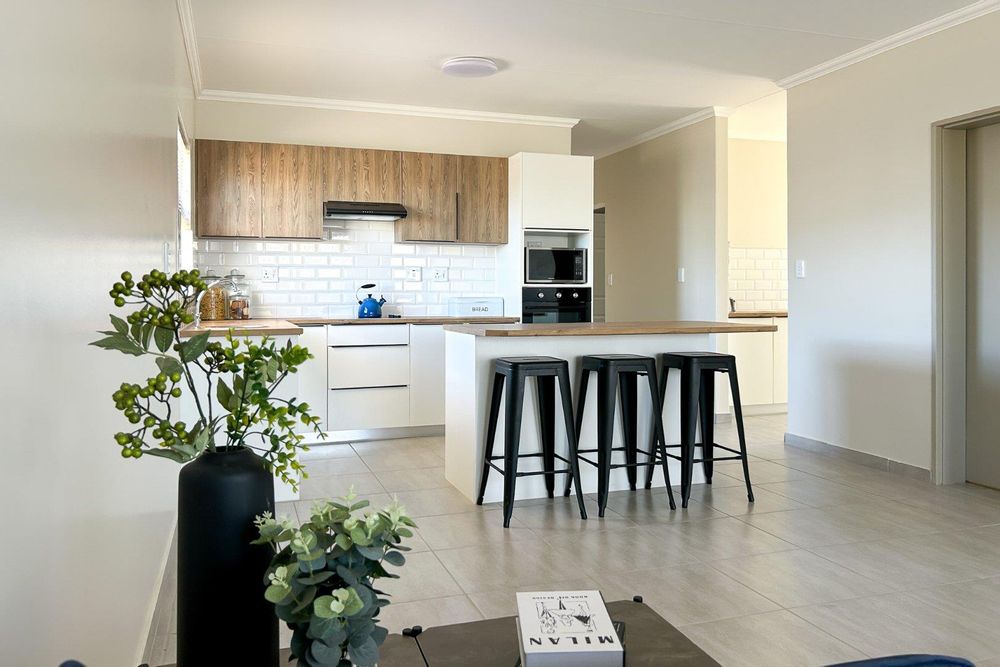 Modern kitchen island with scullery.