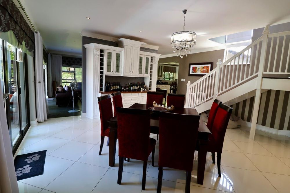 Dining area with sliding door to pool and deck