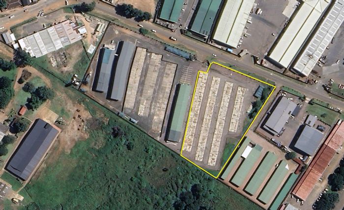 Industrial land for sale in Waterfall Central with electric fencing and car ports.