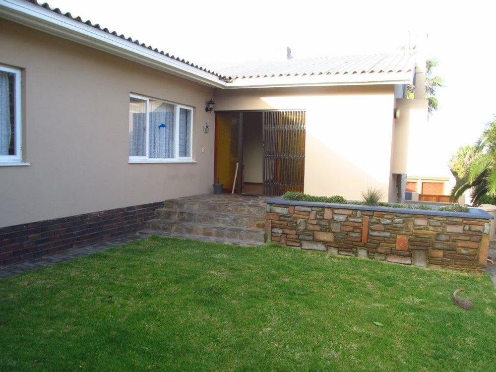 Main entrance to house from garden side on upper level