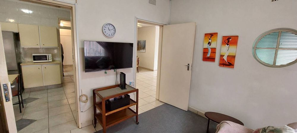 Study view into kitchen and lounge