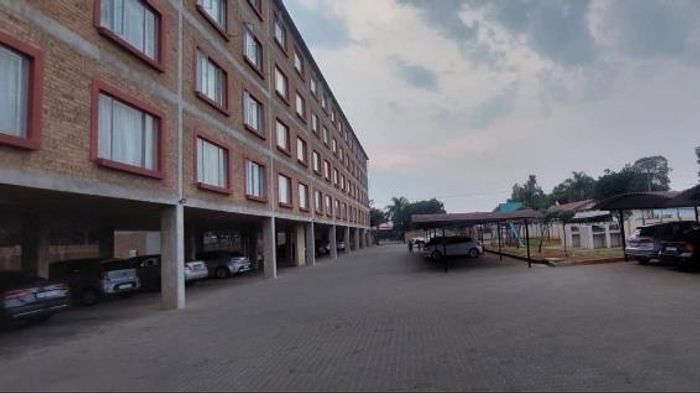 For Sale: Apartment in Pretoria North with 2 bedrooms, open-plan living, and parking.