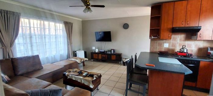 Pet-friendly house in Alberton Central, featuring double carport and spacious layout. To Rent.