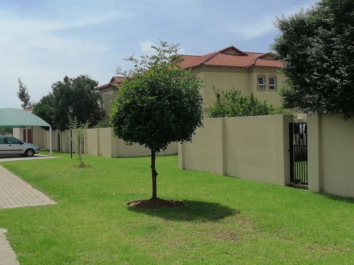 For Sale: Spacious 3-Bedroom Townhouse in Morehill with Large Balcony and Carport.