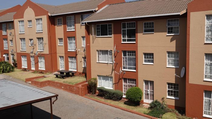 Affordable 2-bedroom apartment in Weltevreden Park, secure complex with garden potential. For Sale.