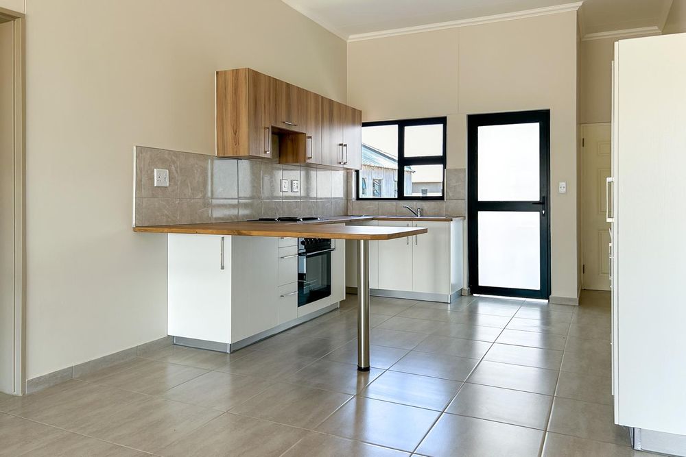 Kitchen with plenty of built-in cupboards and a built-in oven.