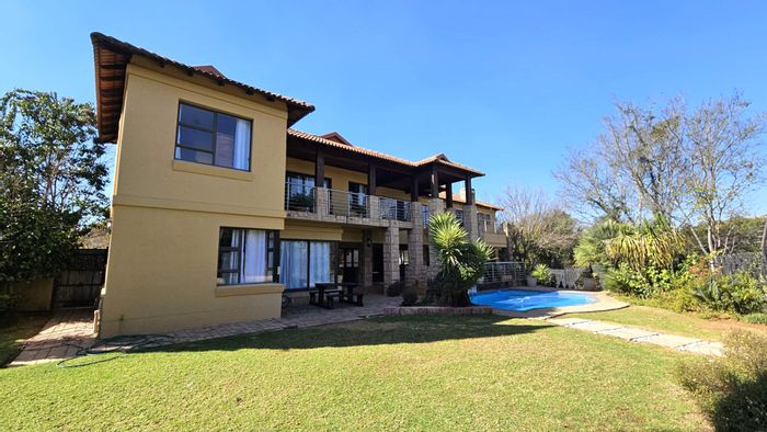 Spacious 5-bedroom house in Birdwood Estate with pool, clubhouse, and tennis courts. For Sale.