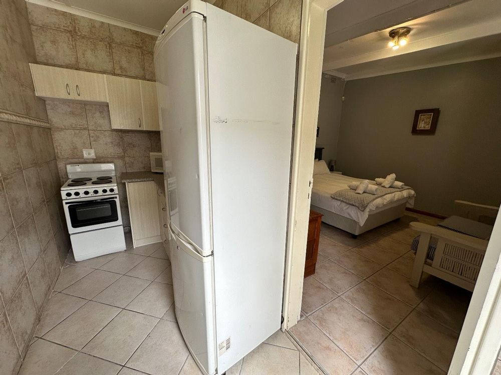 Bedroom 1 and kitchenette of outside flat