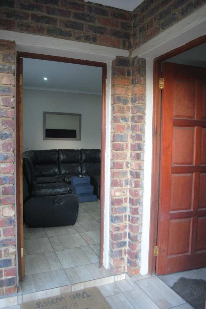 Porch entrance to the nicely lounge open plan kitchen - to the right entrance into the garage