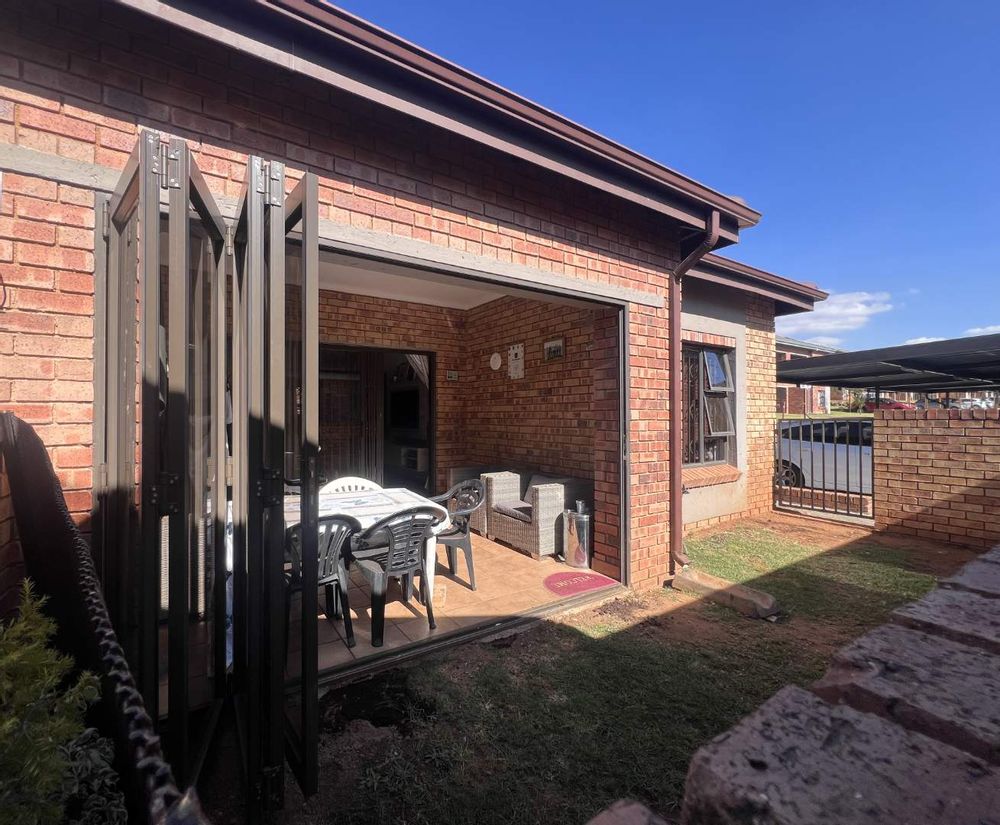 Private garden area off encloed patio with stack doors