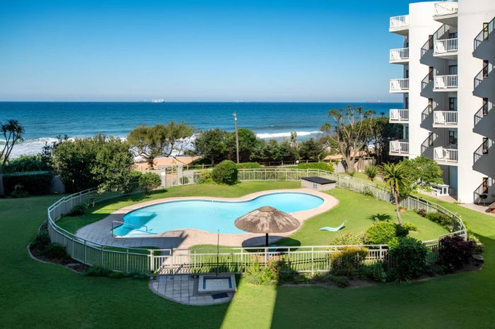 Beachfront apartment in Umdloti Central for sale with private balconies and sea views.