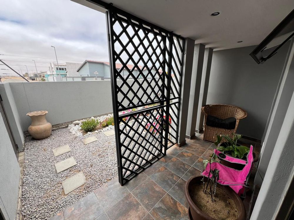 Front yard and front entrance with burglar bars