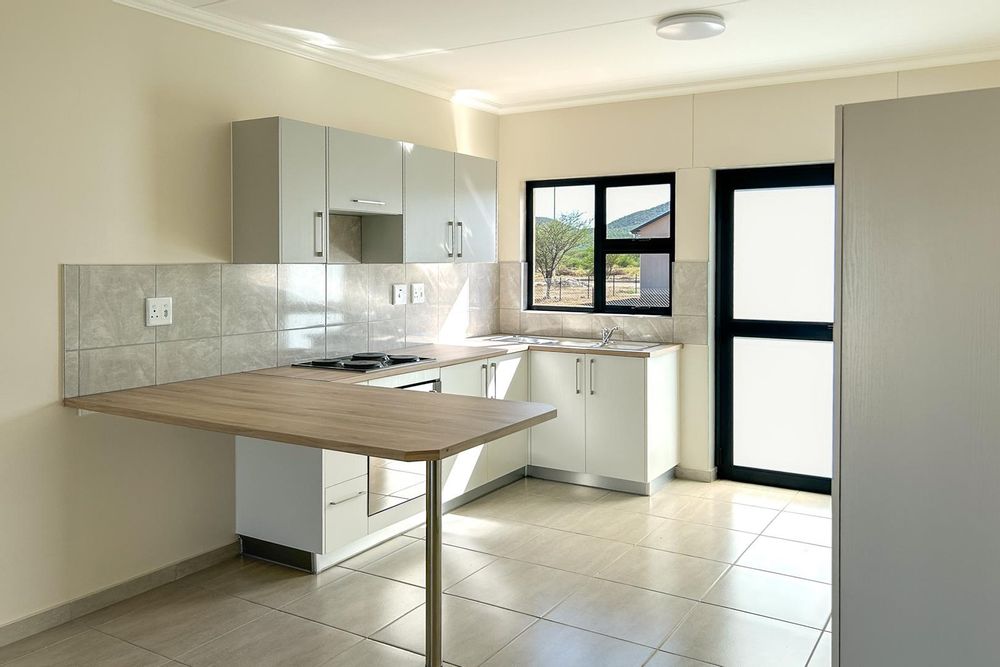 Kitchen with built-in cupboards and oven.