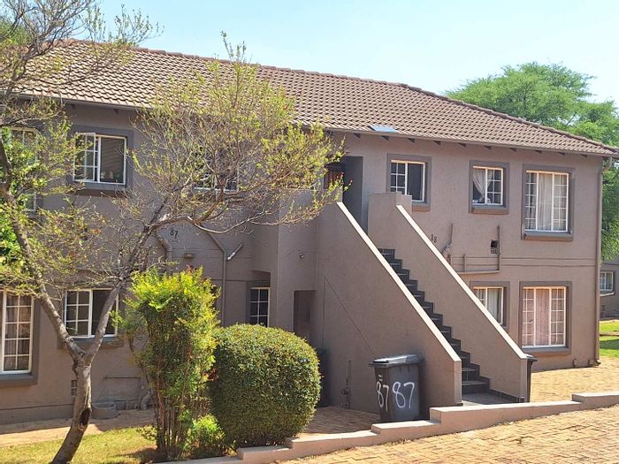 To Rent: Apartment in Wilgeheuwel with balcony, built-in braai, and security.