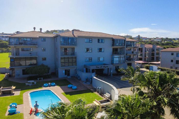 For Sale: Apartment in Hartenbos Central with pool, parking, and balcony access.