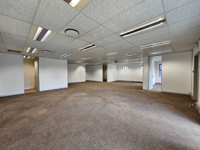 Bryanston Office To Rent: 370sqm, private kitchen, 24-hour security, parking options.