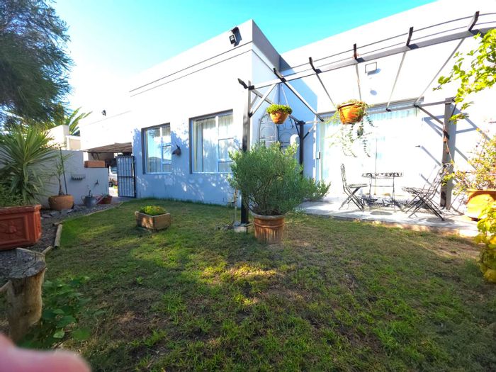 For Sale: House in Parklands with pool, double garage, and low-maintenance garden.