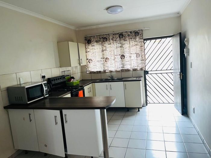 For Sale: Apartment in Otjomuise with 2 bedrooms, courtyard, and lounge.