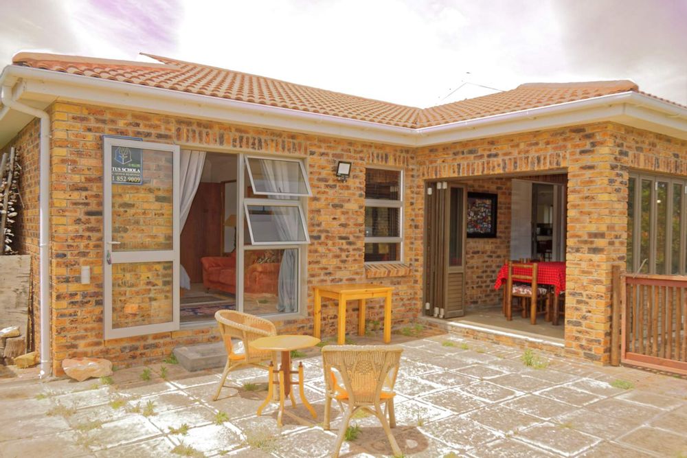 Outside entertainment area with doors to braai room & main bedroom