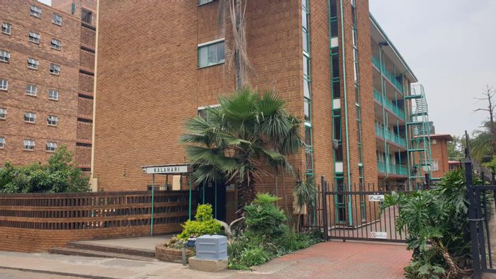 Sunnyside Apartment For Sale: 1-bedroom, parking, kitchen, dining, and lounge areas.