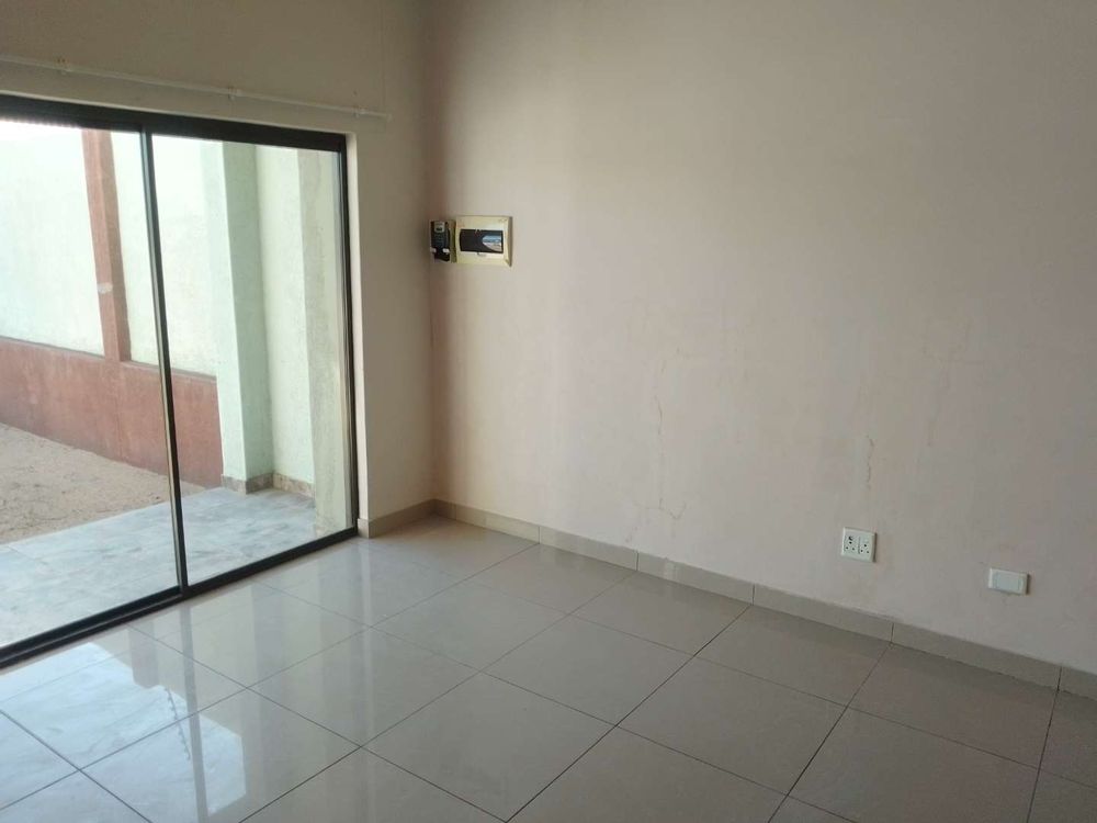 General view of the open area living room / kitchen at the property on offer. 