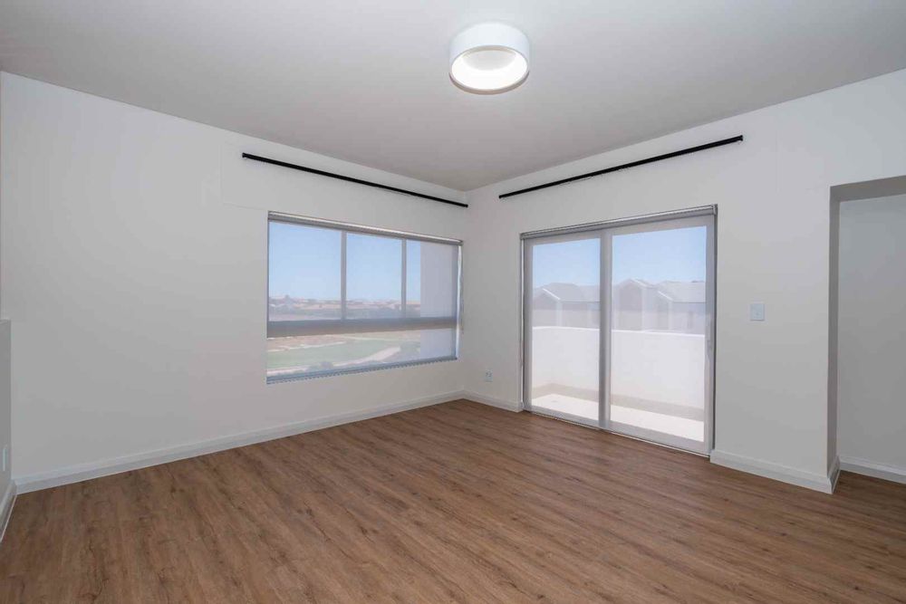 main bedroom with blinds and curtain rods