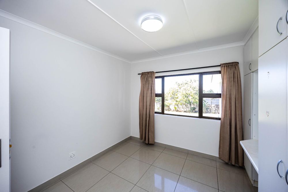 Bedroom 2 with views of the back yard
