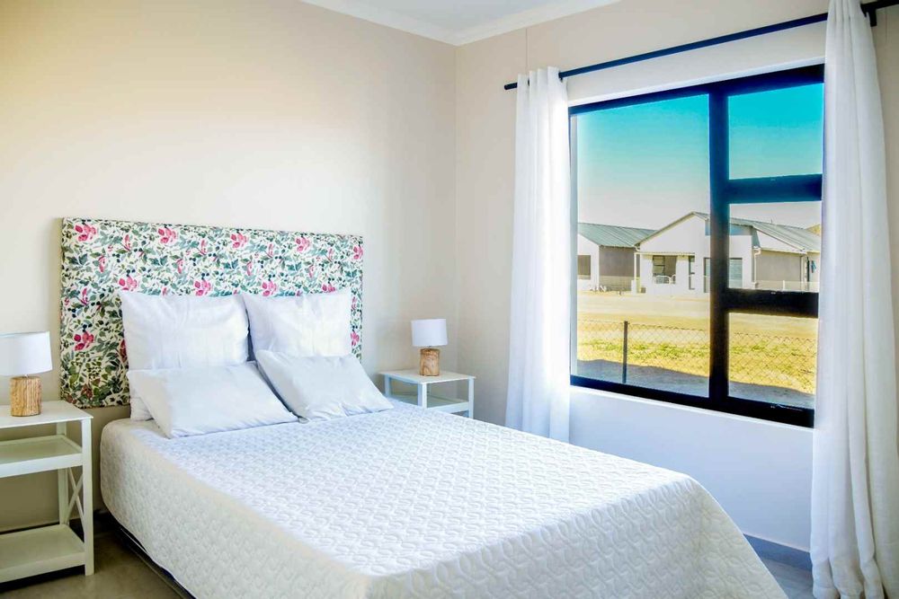 Third bedroom with built-in cupboards.