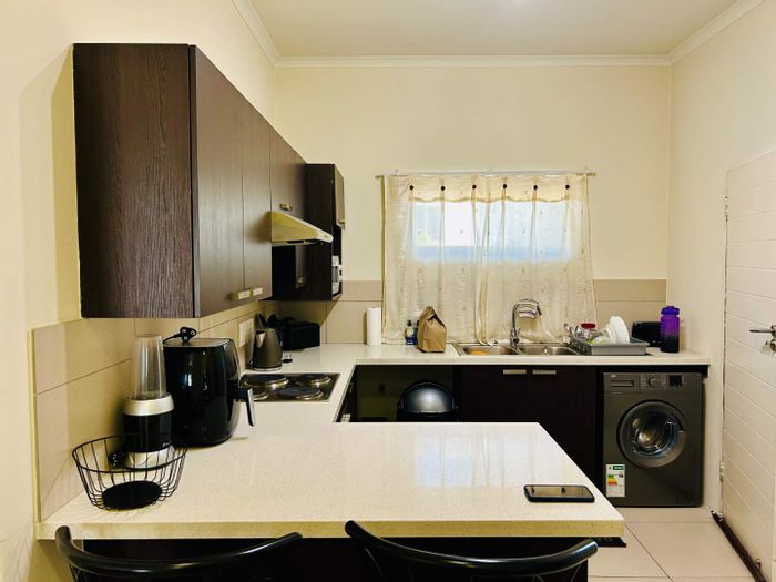 Two-bedroom apartment in Fourways for sale with balcony and ample storage.