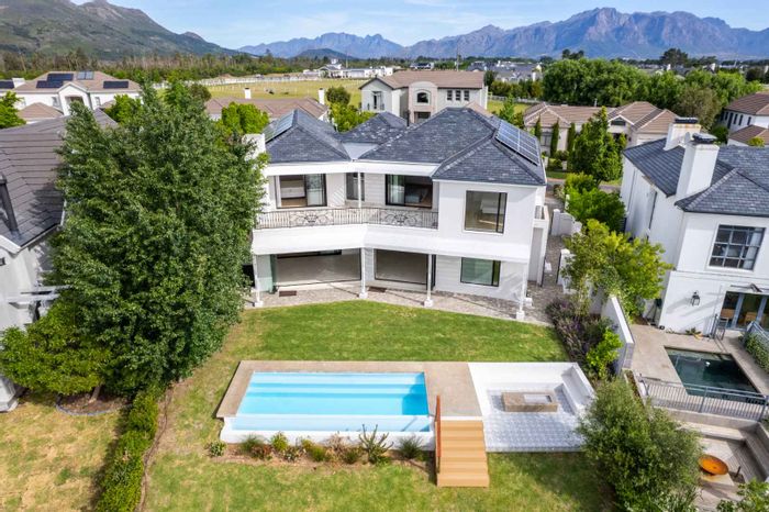 Lakeside House For Sale in Val De Vie Estate with pool, bar, and guest suite.