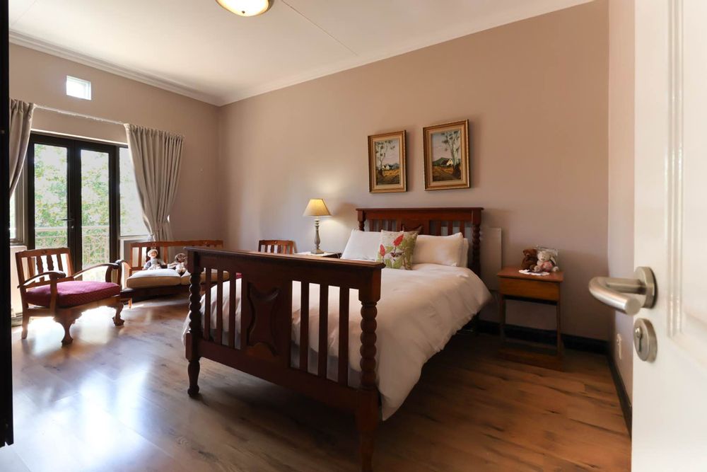 Spacious main bedroom with access to balcony