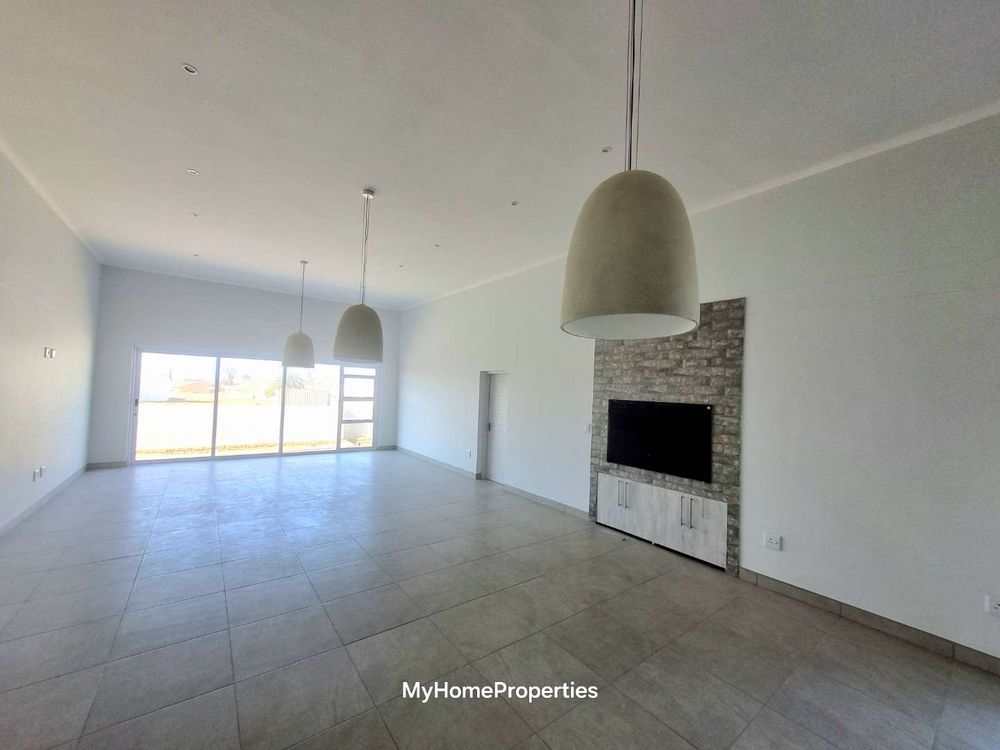 Inside braai area, dining/living room area