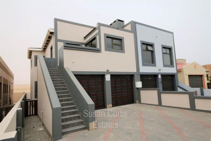 Long Beach Townhouse For Sale: 3 Bedrooms, yard, double garage, dune views.