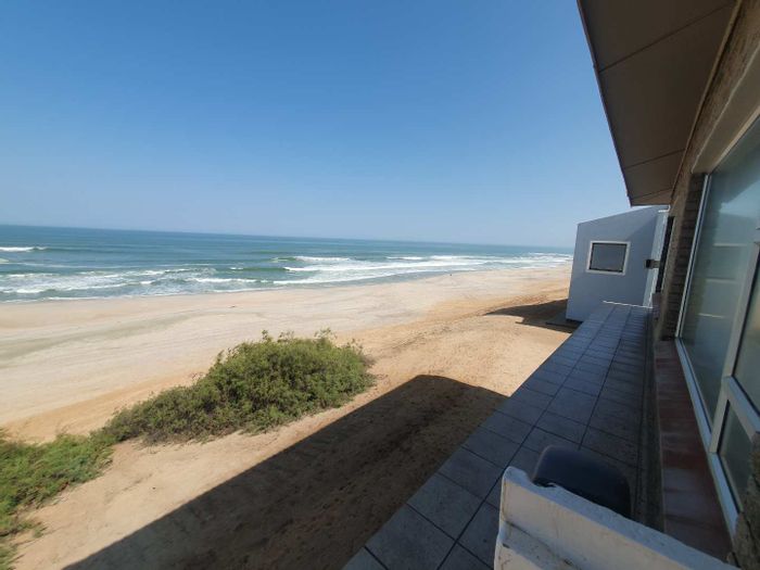 For Sale: House in Henties Bay Central with beachfront access, multiple living spaces, and braai areas.