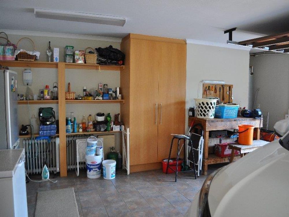 Very large double garage with built in cupboards
